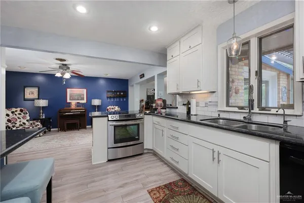 a kitchen with granite countertop lots of counter top space