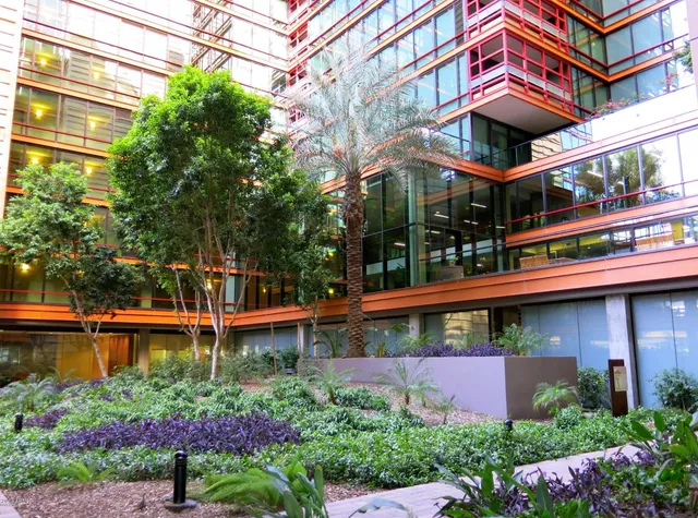 front view of a building with a garden