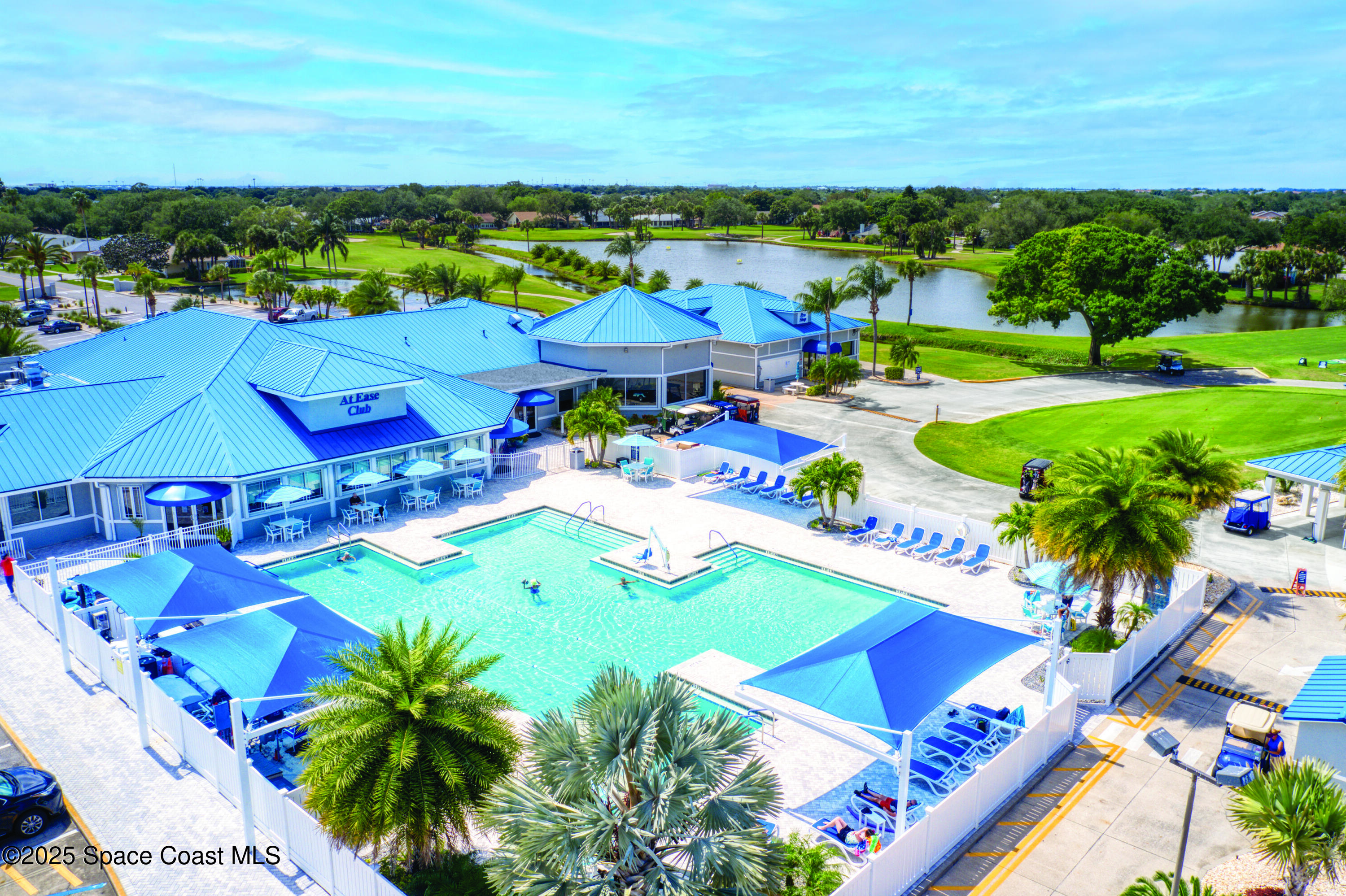 1663 Independence Avenue Melbourne, FL 32940 - Photo 33 of 41 3 club-pool-aerial