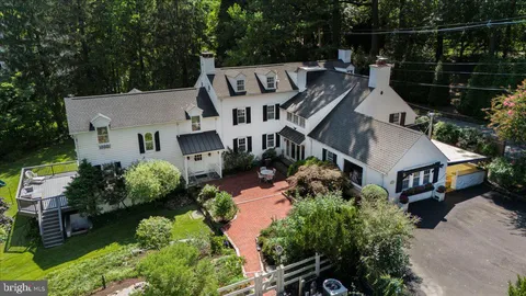 an aerial view of a house with outdoor space