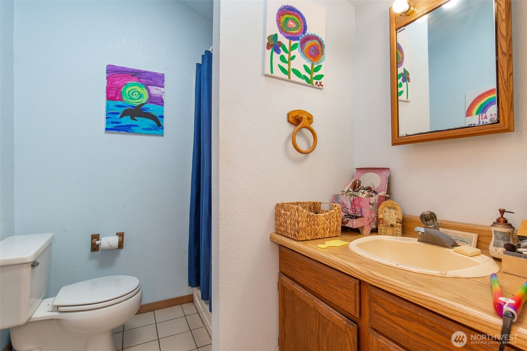 1497 Old Military Road Southeast Tenino, WA 98589 - Photo 14 of 34 a bathroom with a sink mirror and toilet