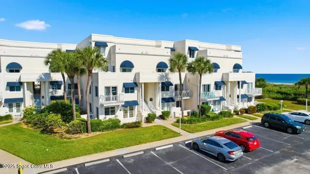 a front view of building with yard