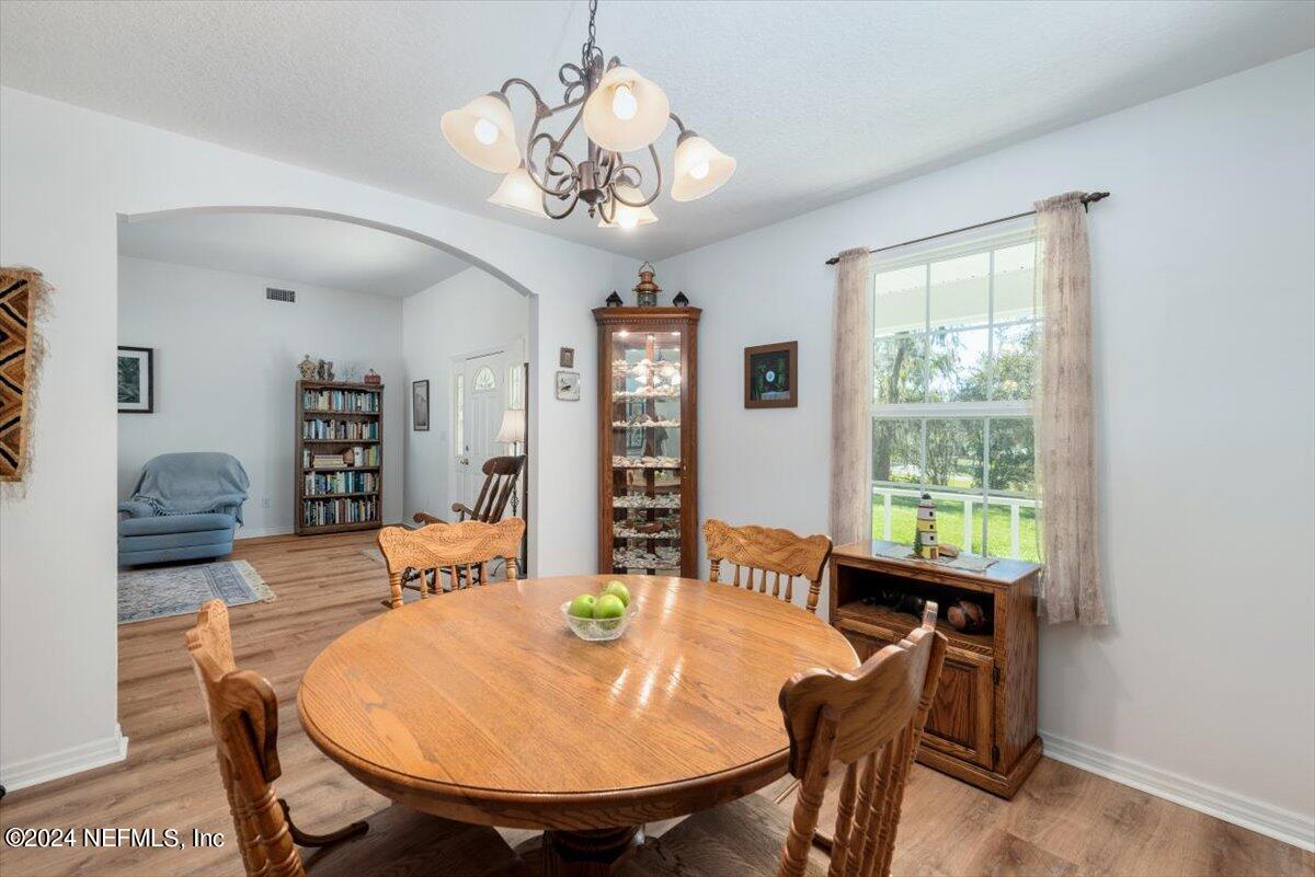 6481 Brooklyn Bay Road Keystone Heights, FL 32656 - Photo 11 of 45 a view of a dining room with furniture