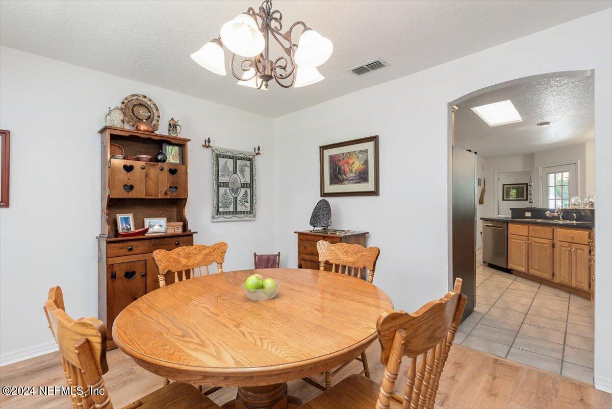 6481 Brooklyn Bay Road Keystone Heights, FL 32656 - Photo 13 of 45 a view of a dining room with furniture
