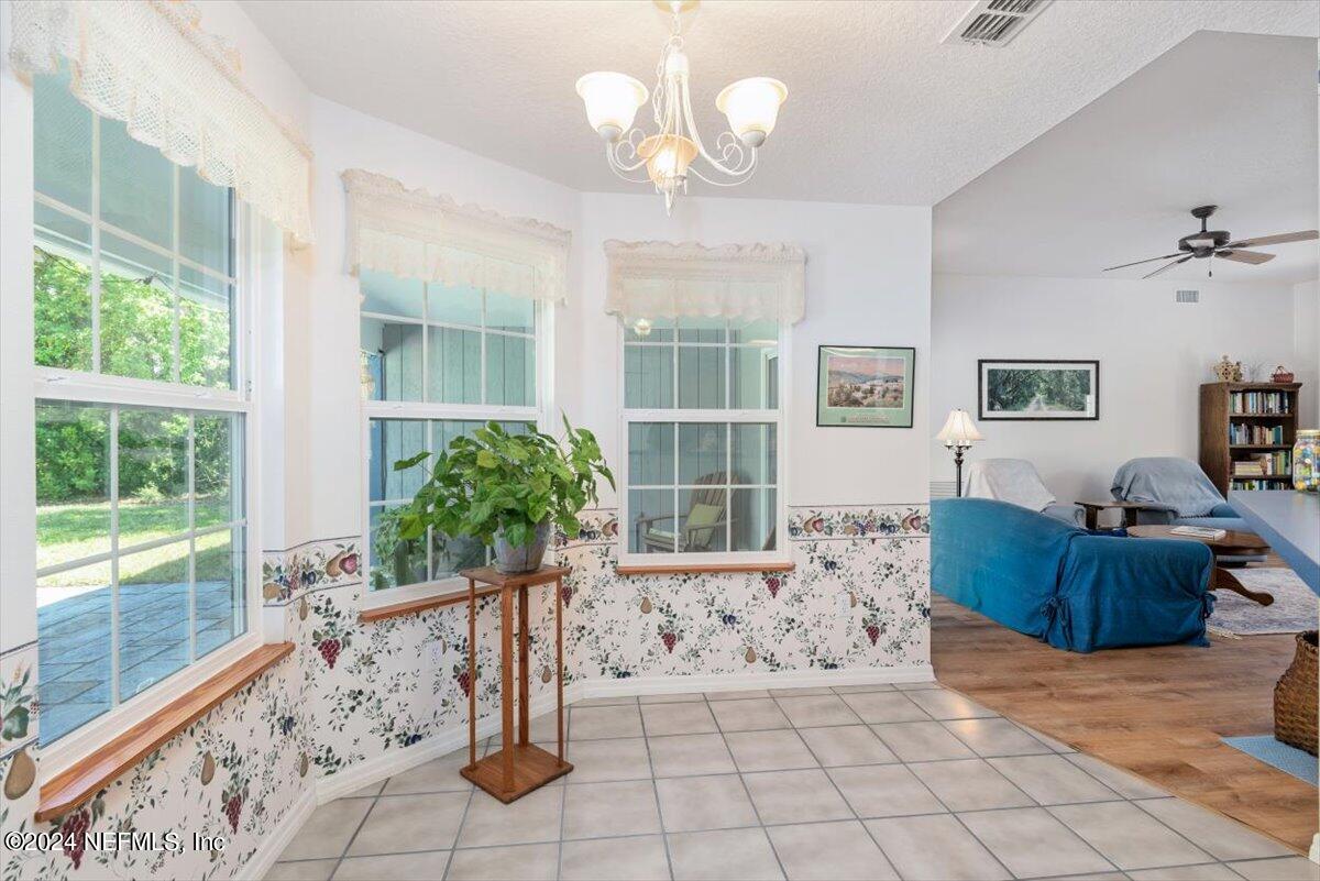 6481 Brooklyn Bay Road Keystone Heights, FL 32656 - Photo 19 of 45 a living room with furniture and a large window