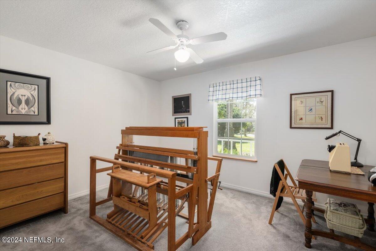 6481 Brooklyn Bay Road Keystone Heights, FL 32656 - Photo 29 of 45 a bedroom with a bed and a desk