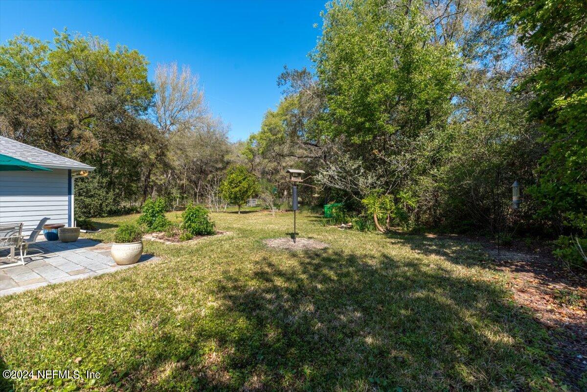 6481 Brooklyn Bay Road Keystone Heights, FL 32656 - Photo 35 of 45 a view of a backyard with sitting area