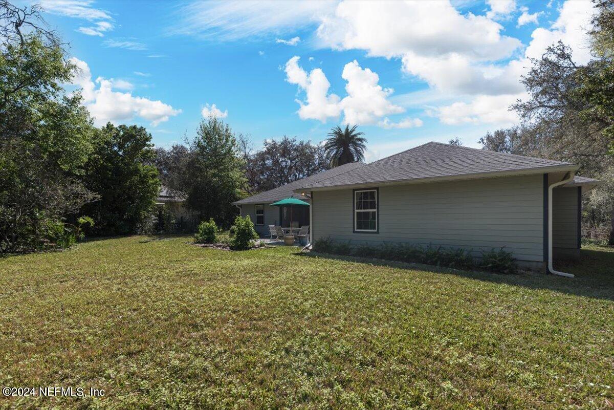 6481 Brooklyn Bay Road Keystone Heights, FL 32656 - Photo 37 of 45 a view of a house with a backyard