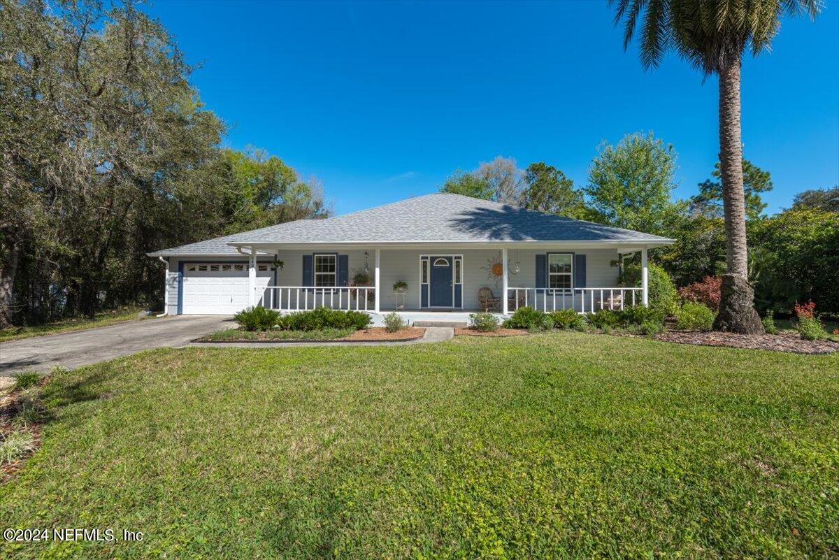 6481 Brooklyn Bay Road Keystone Heights, FL 32656 - Photo 4 of 45 a front view of a house with yard patio and green space