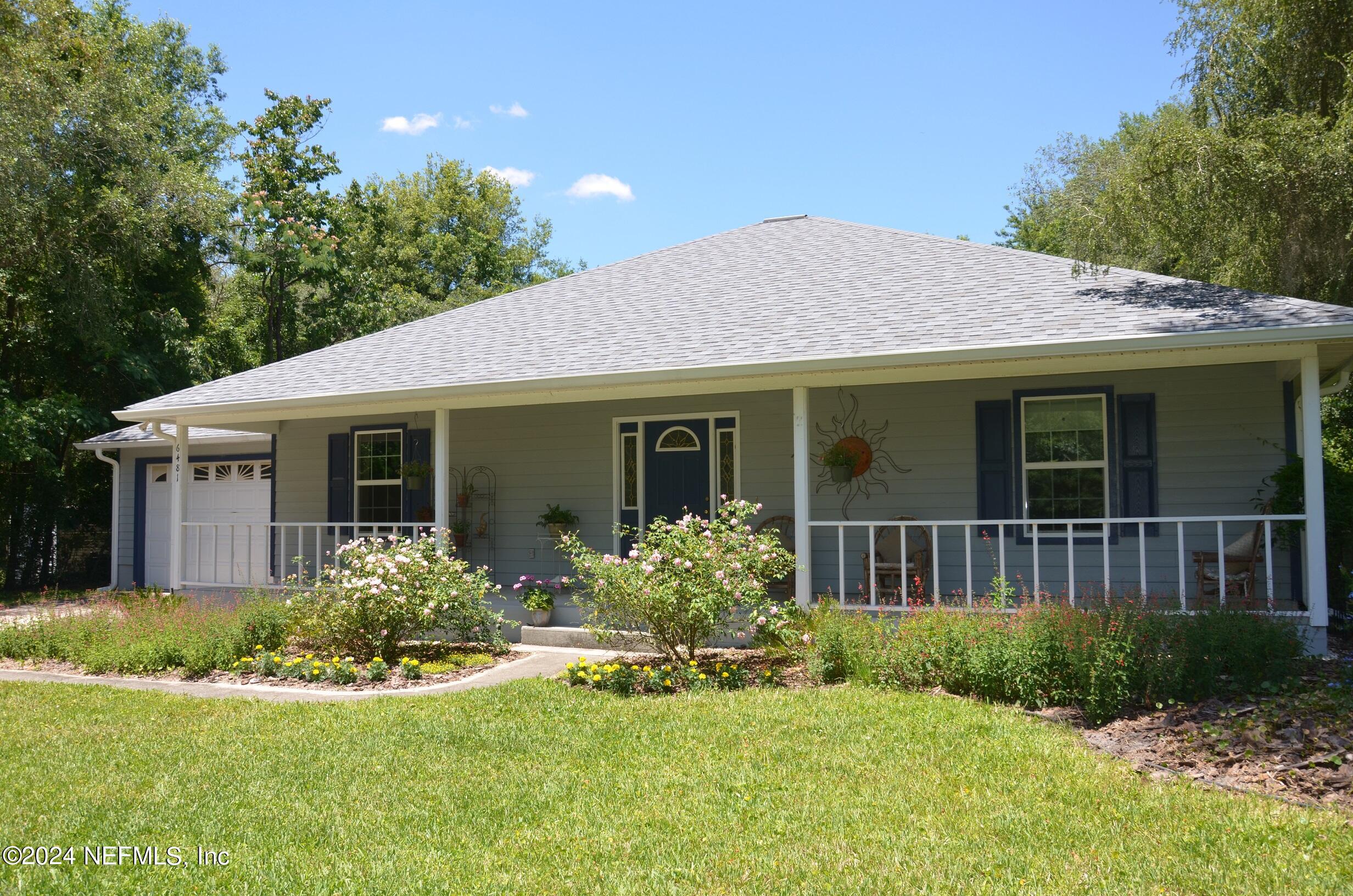 6481 Brooklyn Bay Road Keystone Heights, FL 32656 - Photo 41 of 45 a front view of a house with a yard