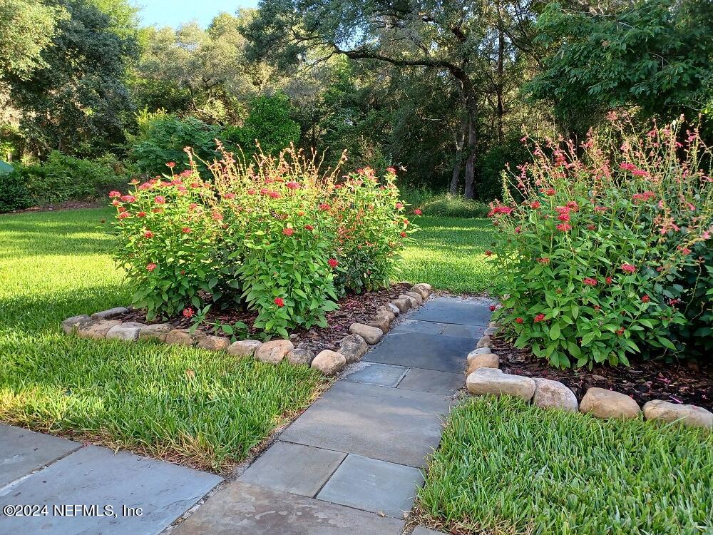 6481 Brooklyn Bay Road Keystone Heights, FL 32656 - Photo 43 of 45 a view of a garden with flowers
