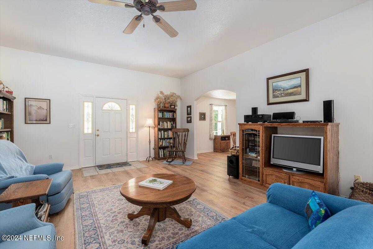 6481 Brooklyn Bay Road Keystone Heights, FL 32656 - Photo 7 of 45 a living room with furniture and a wooden floor