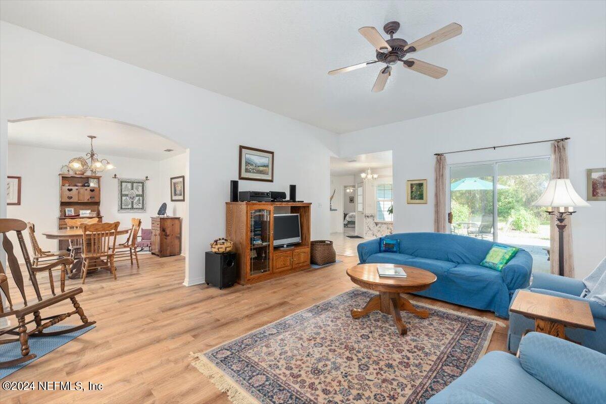6481 Brooklyn Bay Road Keystone Heights, FL 32656 - Photo 9 of 45 a living room with furniture a rug and a fireplace