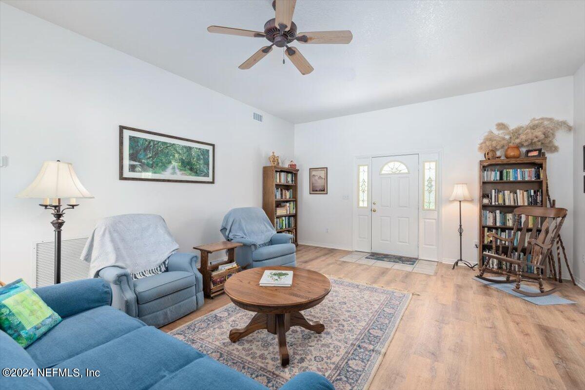 6481 Brooklyn Bay Road Keystone Heights, FL 32656 - Photo 10 of 45 a living room with furniture a rug and white walls