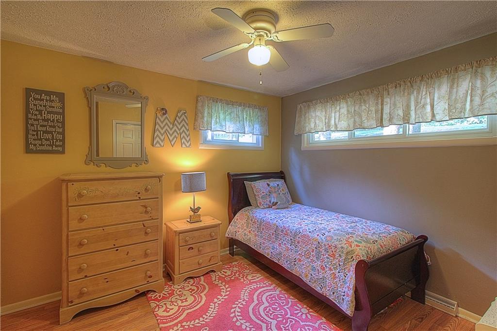 687 Park Road Beaver Falls, PA 15010 - Photo 11 of 22 BEDROOM 3 is located on the Main Level. Neutral tones and original hardwood floors.