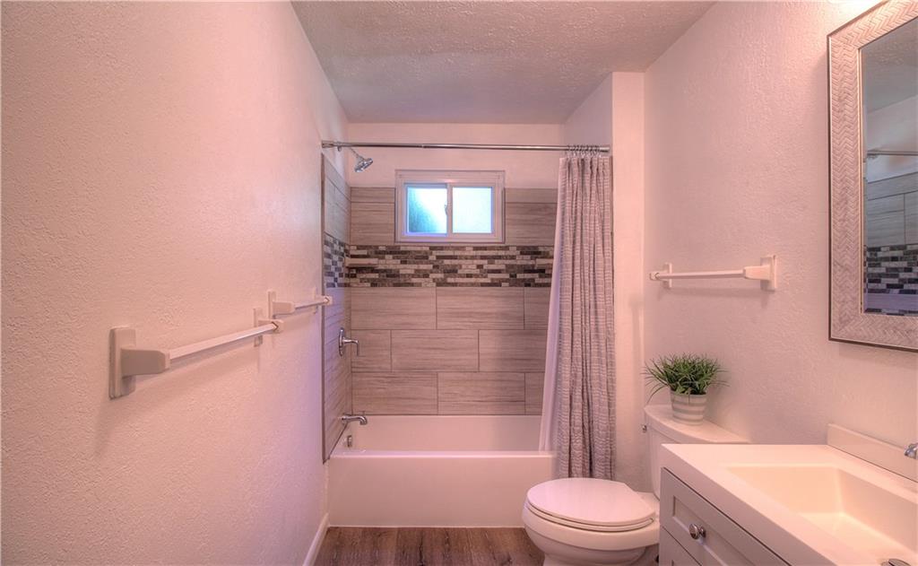 687 Park Road Beaver Falls, PA 15010 - Photo 13 of 22 FULL BATH located on the main floor has just been remodeled. It has all new fixtures in neutral gray and white tones.