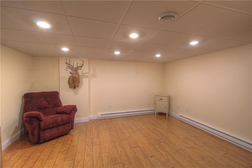 687 Park Road Beaver Falls, PA 15010 - Photo 14 of 22 FAMILY ROOM located on the lower level. Plenty of room for furniture, trophies and your television. Neutral tones and laminated floor for easy care. Chicago grid ceiling.