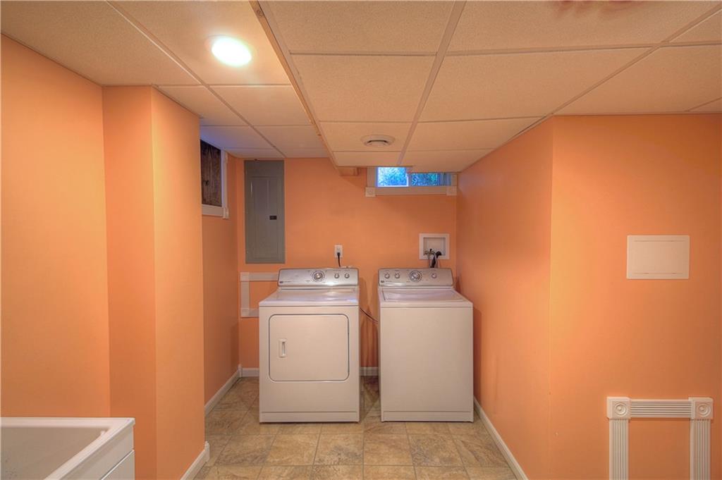 687 Park Road Beaver Falls, PA 15010 - Photo 15 of 22 LAUNDRY Lower level. Plenty of room for additional storage. Ceramic floors and Chicago grid ceiling.