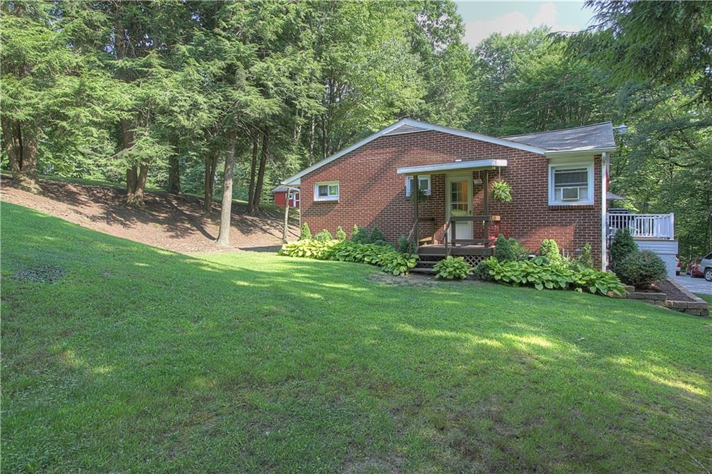 687 Park Road Beaver Falls, PA 15010 - Photo 19 of 22 Left side view of home showing side yard with door from Kitchen.