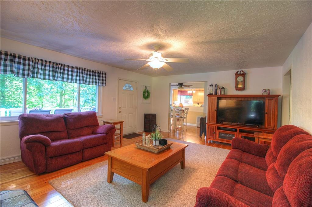 687 Park Road Beaver Falls, PA 15010 - Photo 4 of 22 LIVING ROOM Another view facing the Dining Room. Door on left leads to the composite deck.