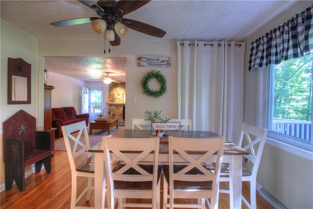 687 Park Road Beaver Falls, PA 15010 - Photo 5 of 22 DINING ROOM is open to both the Kitchen and the Living Room. It is large enough for a nice sized table. Spacious panty behind the curtain. Hardwood floors. Neutral fresh tones.