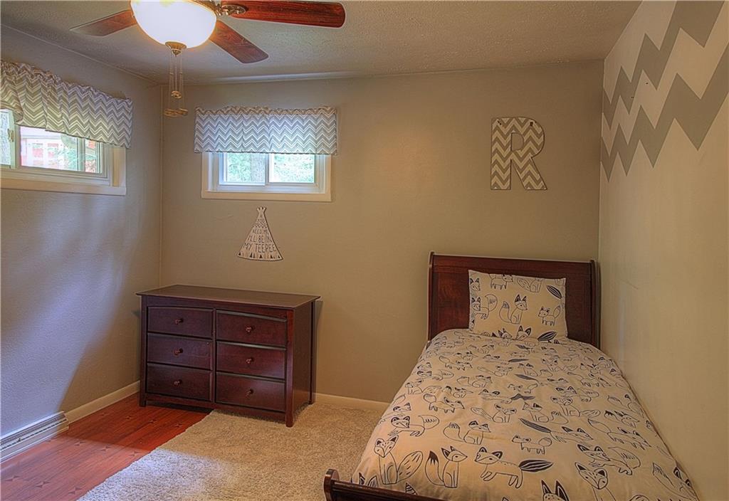 687 Park Road Beaver Falls, PA 15010 - Photo 10 of 22 BEDROOM 2 is located on the Main Level. Neutral tones and original hardwood floors.