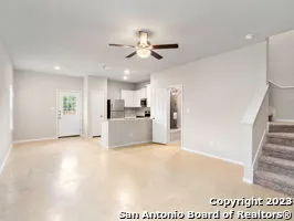 a view of a kitchen with wooden floor and a kitchen