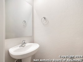7356 Misty Ridge Drive, Unit 5 Converse, TX 78109 - Photo 10 of 25 a bathroom with a sink and mirror