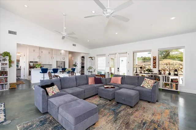 a dining room with furniture and wooden floor
