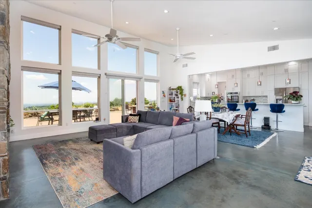 a kitchen with stainless steel appliances kitchen island granite countertop a sink and a granite counter tops