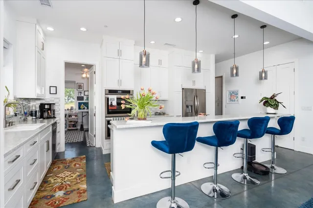 a kitchen with sink and cabinets