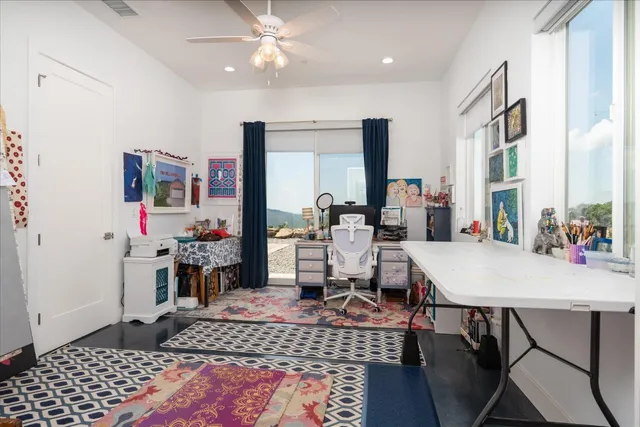 a bedroom with a bed and a desk