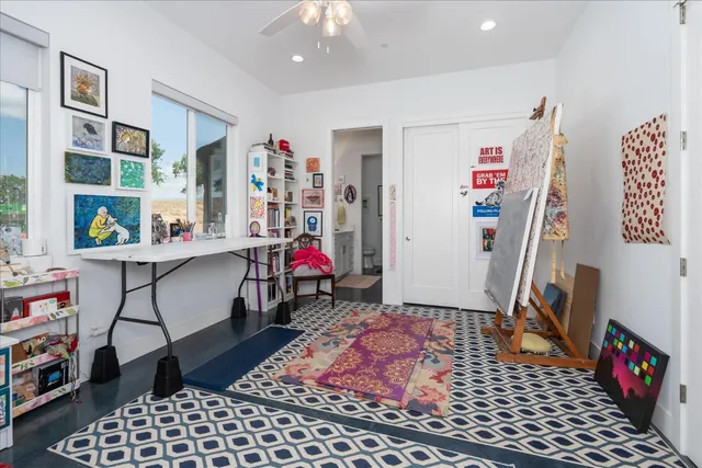 a bedroom that has a bed and a dresser in it