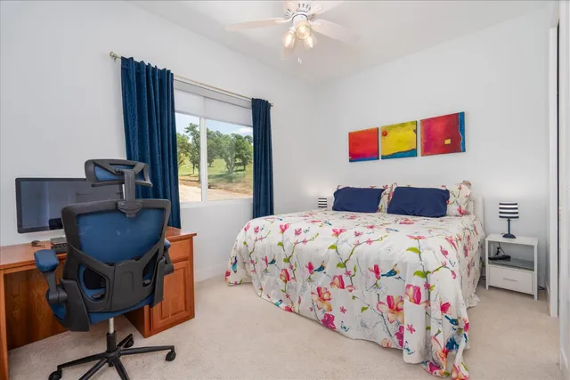 a bathroom with a toilet and a shower curtain