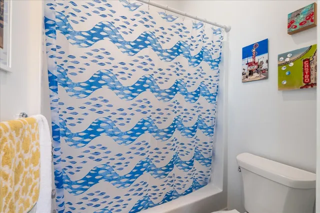 a bathroom with a bathtub and window