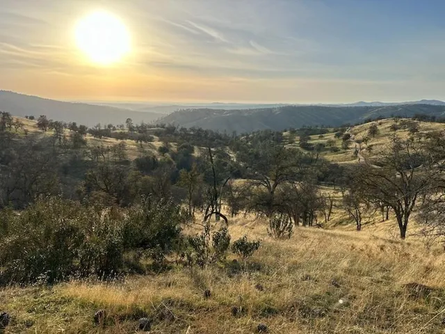 a view of a town with mountains in the background