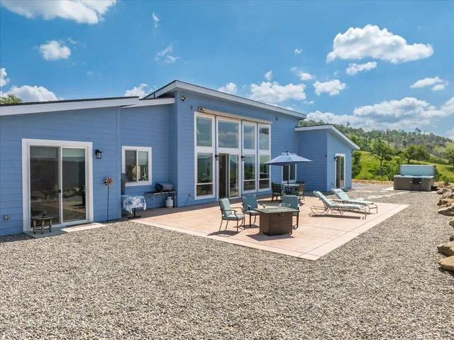 an aerial view of a backyard with swimming pool