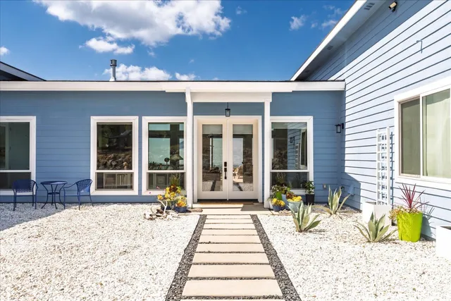 a living room with fireplace furniture and a flat screen tv