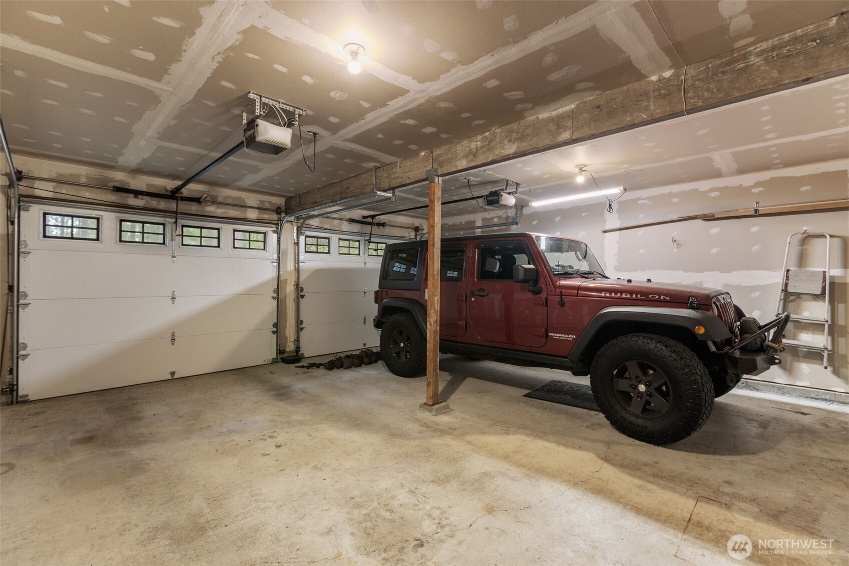 100 East Twanoh Heights Road South Belfair, WA 98528 - Photo 29 of 40 a view of a garage of car parked