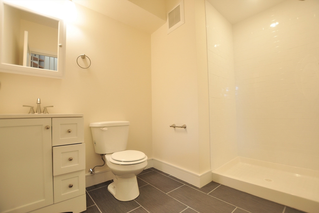 877 Beacon Street, Unit 1 Boston, MA 02215 - Photo 4 of 12 a bathroom with a toilet and a sink