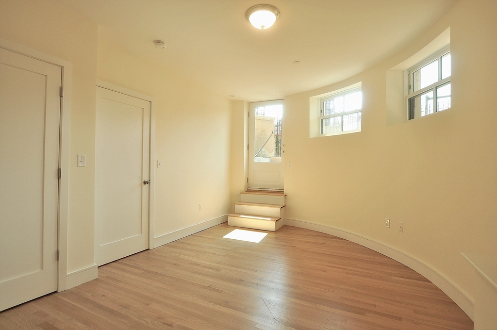 877 Beacon Street, Unit 1 Boston, MA 02215 - Photo 7 of 12 a view of empty room with wooden floor