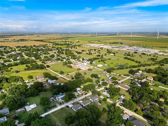 an aerial view of residential houses with outdoor space