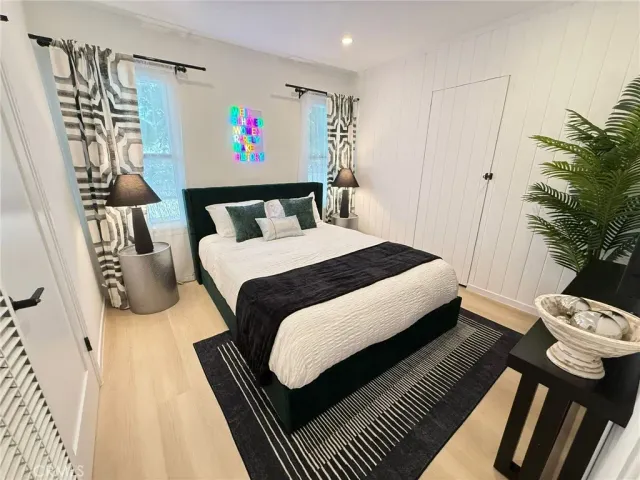 a bedroom with a bed and a couch