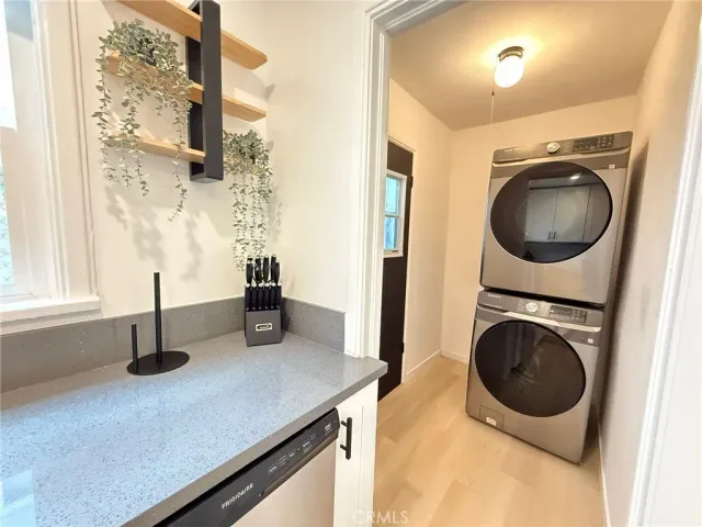 a kitchen with a sink a washer and dryer