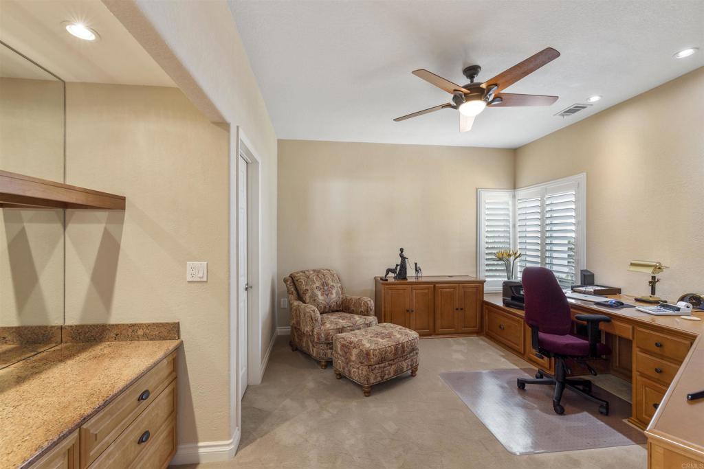 4926 Tilos Way Oceanside, CA 92056 - Photo 13 of 63 a living room with furniture and a window