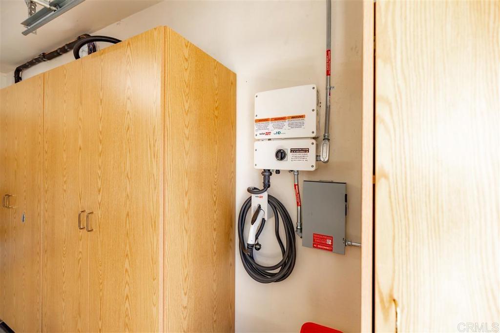 4926 Tilos Way Oceanside, CA 92056 - Photo 31 of 63 a view of a hallway with a washer and dryer
