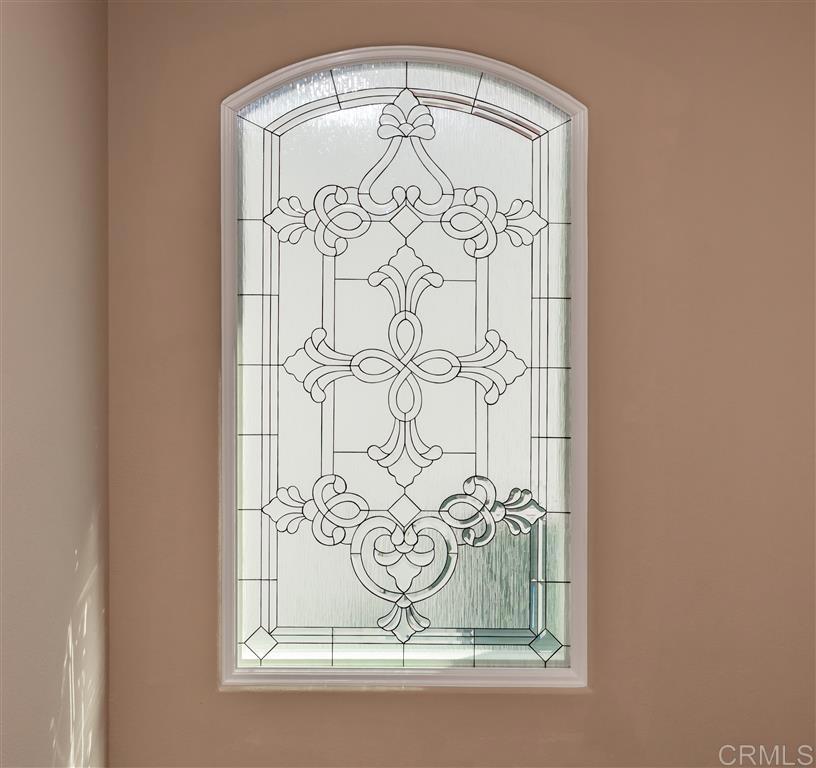 4926 Tilos Way Oceanside, CA 92056 - Photo 34 of 63 a close up of a wall with a mirror