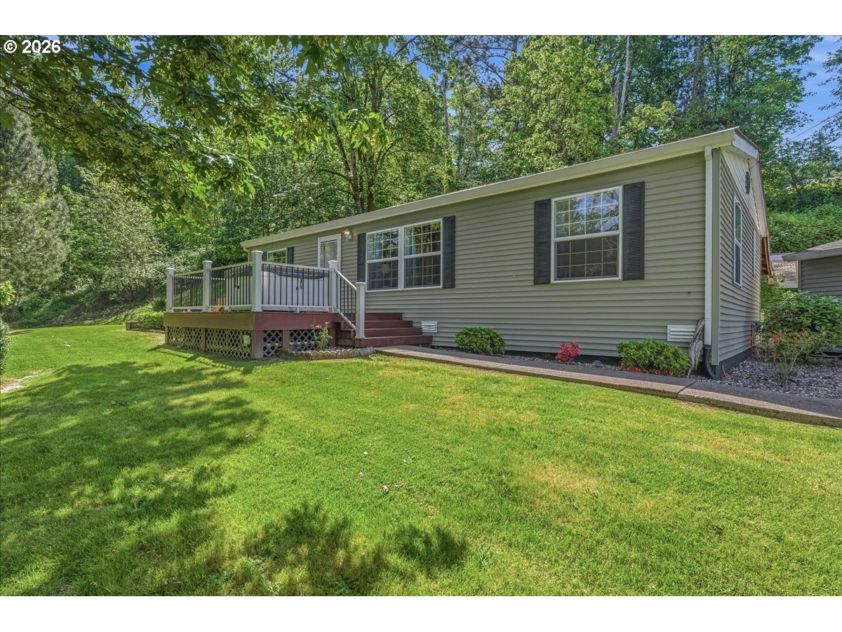 475 East 9th Street Rainier, OR 97048 - Photo 1 of 43 a front view of house with yard and green space