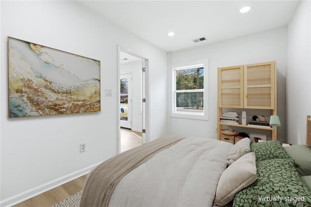 2277 Edgemore Drive Southeast Atlanta, GA 30316 - Photo 38 of 48 a bedroom with a bed painting on wall and a large window