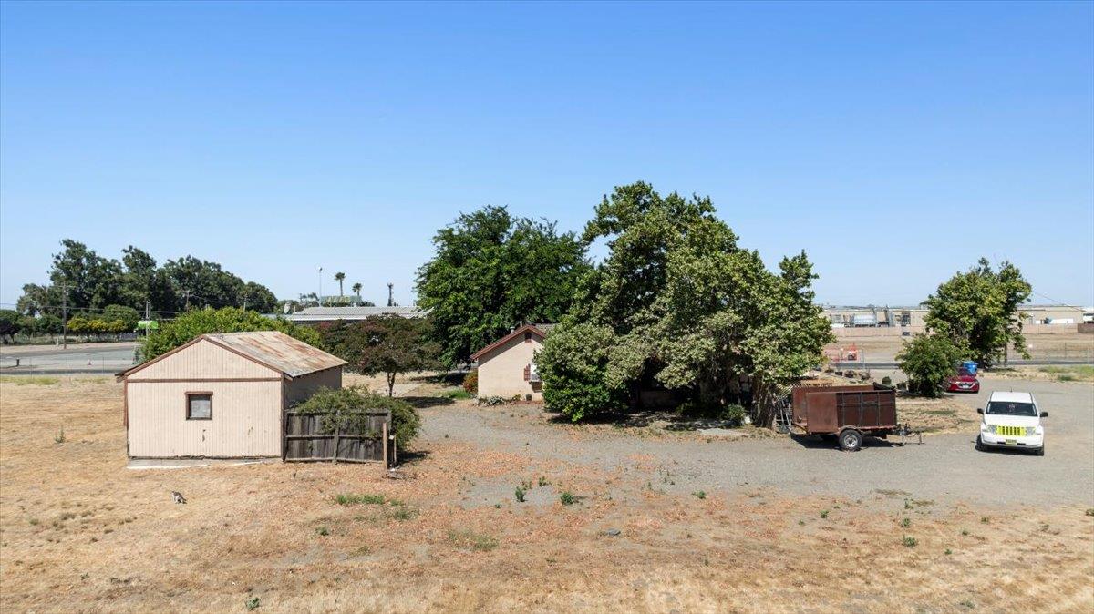 140 Swanson Road Manteca, CA 95337 - Photo 14 of 26 a view of a wooden house with a yard